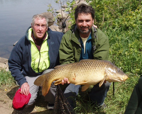 Lawrence holding his 33lb 8oz Carp with Miles