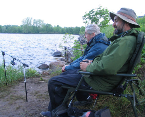 Miles and Lawrence sitting with their rods on the rod-rests