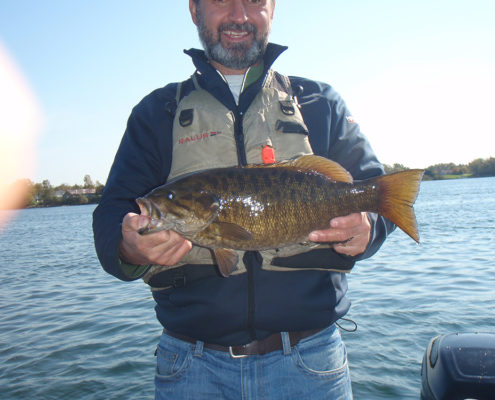 Lawrence holding smallie number 3