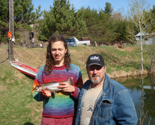 Walter with Nico holding a 16” Rainbow Trout