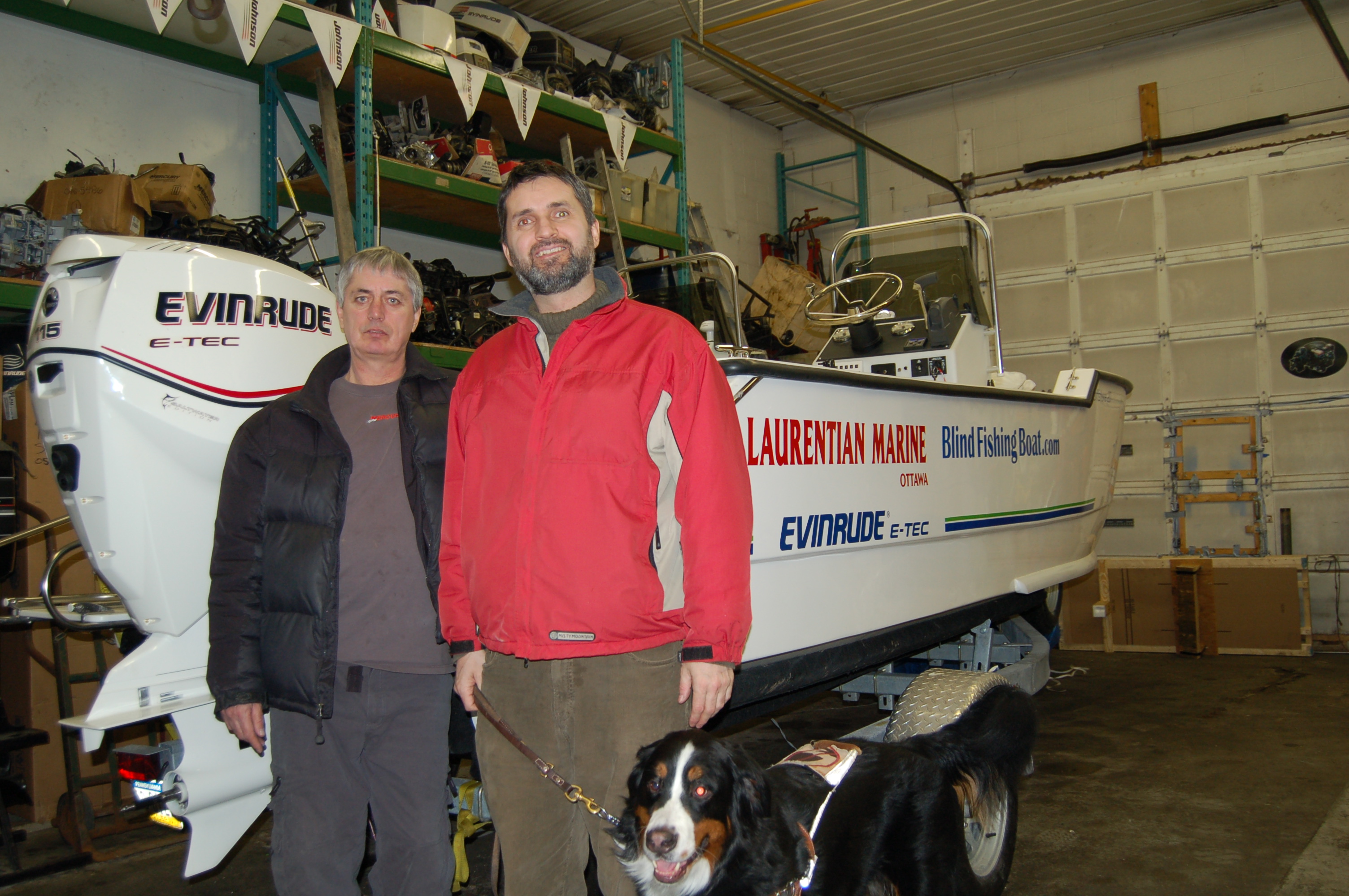 Laurentian Marine owner Alfred McDonald standing next to Lawrence and Meastro