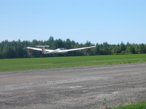 Photo of Lawrence landing in the glider